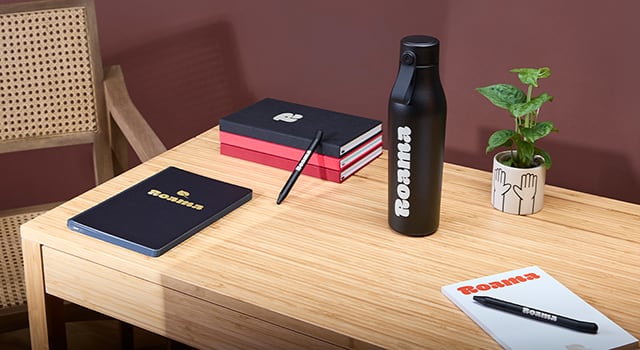 A branded MOO Water Bottle in Midnight Blue